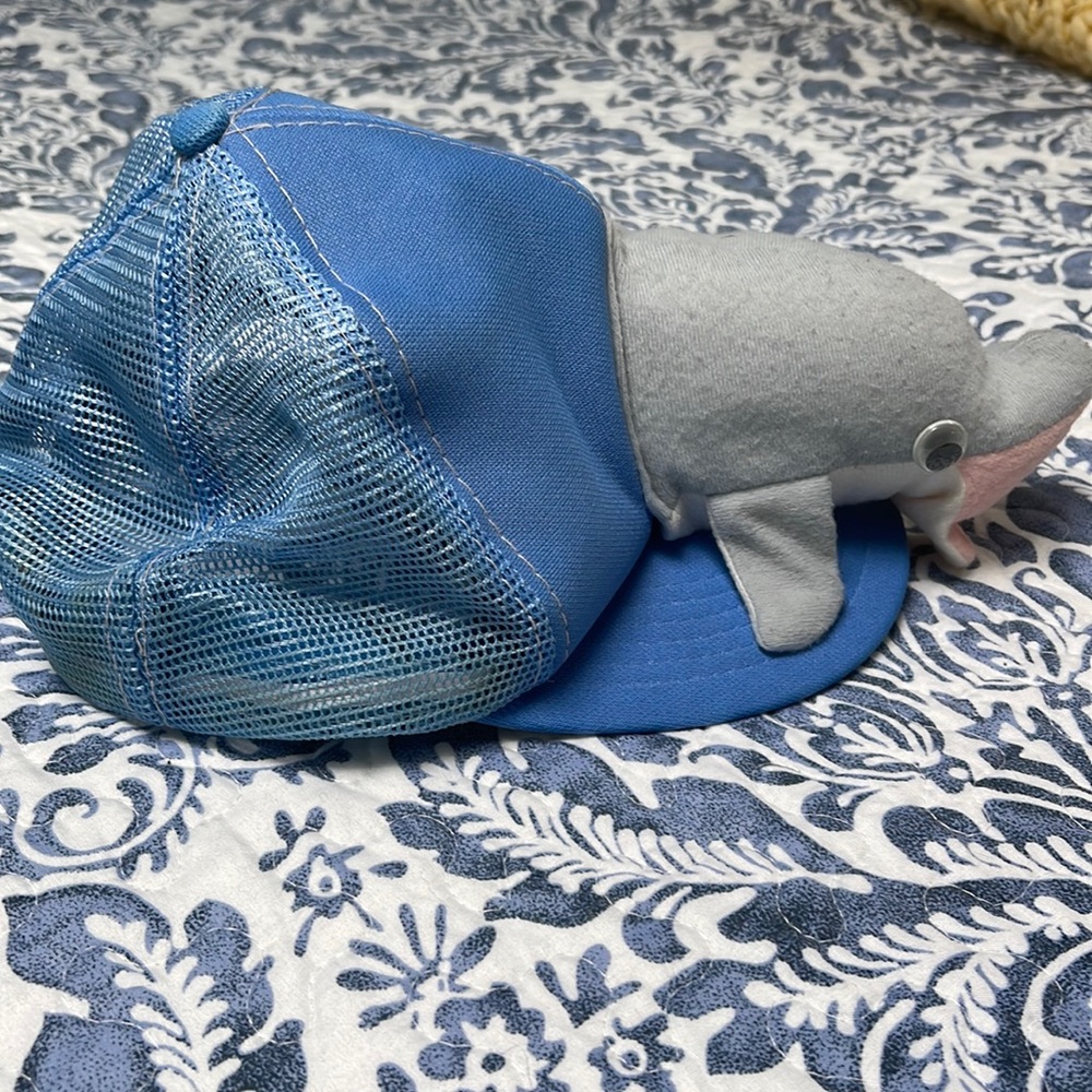 Friendly dolphin novelty cap. Adjustable  worn but decent condition Cute cute!